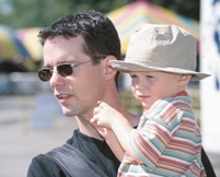 Photo of a father holding his son in his arms